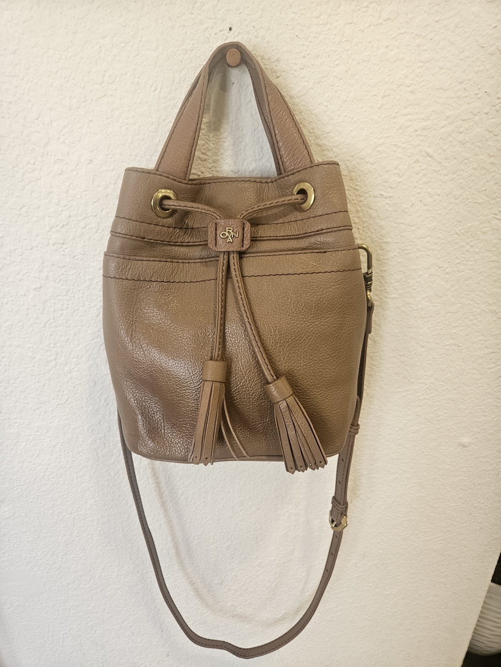 orYANY Caramel Pebbled Leather Crossbody Bucket Bag w/ Tassels & Logo Lining